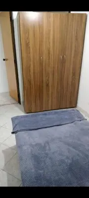 a room with a blue rug in front of a door at En el mejor punto de Medellin in Medellín