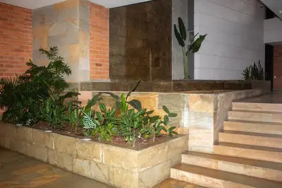 a set of stairs in a building with plants at Apartment near Provence pool, gym, views and WiFi in Medellín