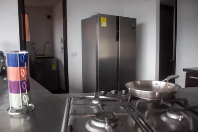 a kitchen stove with a bowl on top of it at Apartment near Provence pool, gym, views and WiFi in Medellín