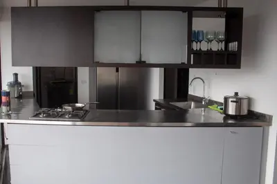 a kitchen with a sink and a counter top at Apartment near Provence pool, gym, views and WiFi in Medellín