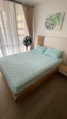 a large bed in a bedroom with a window at El Poblado, Medellin, Antioquia, Colombia in Medellín
