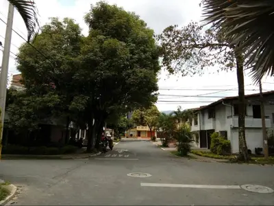 an empty street with trees on the side of the road at Acogedora Habitación Privada - Belén Rosales Laureles in Medellín