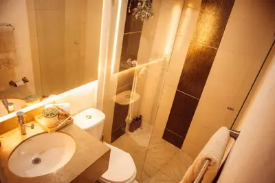 a bathroom with a shower and a toilet and a sink at Casa Samai Embera in Rionegro