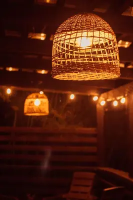 a chandelier hanging from a ceiling with lights at Casa Samai Embera in Rionegro