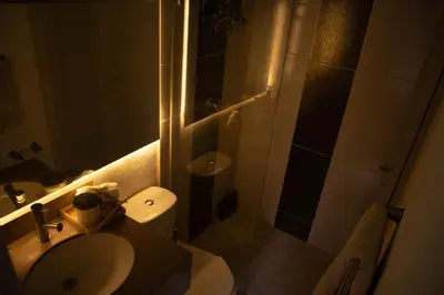 a bathroom with a toilet and a sink and a shower at Casa Samai Embera in Rionegro
