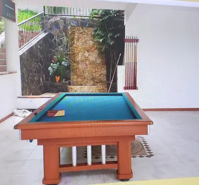 a pool table in the middle of a room at Cabaña en Copacabana Antioquia, cerca a Medellín in Copacabana