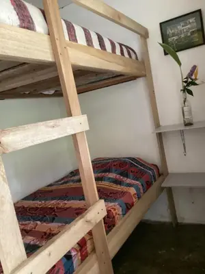 a bedroom with two bunk beds in a room at Hostal Las Hamacas,Habitación #5 in Villamaría