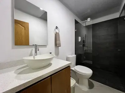 a bathroom with a sink and a toilet at Apartamento Carmelina-solo a dos cuadras del parque in Carmen de Viboral
