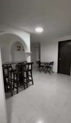 a room with chairs and tables in a building at CÓMODO APARTAMENTO CERCA De TODO EN ENVIGADO in Envigado
