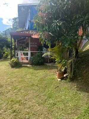 a building with a store with plants in a yard at Finca La Tabaiba in Fredonia