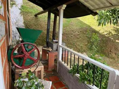 a porch with a wheel next to a fence at Finca La Tabaiba in Fredonia