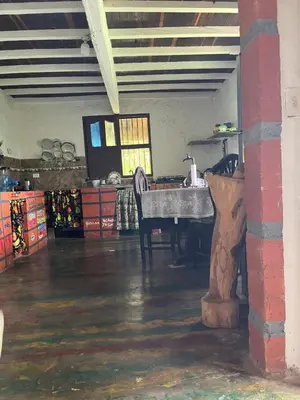 a room with a table and chairs in a building at Finca La Tabaiba in Fredonia