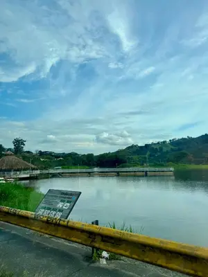 a sign on the side of a body of water at Casa Irene in Chinchiná