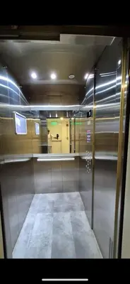 a reflection of a room with a mirror in a bathroom at Mirador del Ruiz Aparta Estudio in Manizales