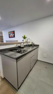 a kitchen with a sink and a counter top at Mirador del Ruiz Aparta Estudio in Manizales