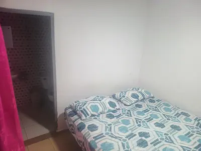 a bedroom with a bed with a pillow on it at La fonda in Santa Rosa de Cabal