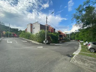 an empty street with a car parked on the side at Apartasol En San Jeronimo in San Jerónimo