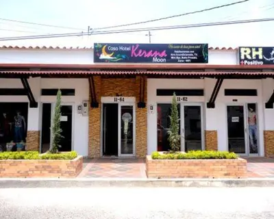 a building with a sign on the front of it at Hotel kerana moon in Puerto Boyacá