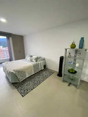 a bedroom with a bed and a book shelf at comodo y acogedor apartamento in Sabaneta