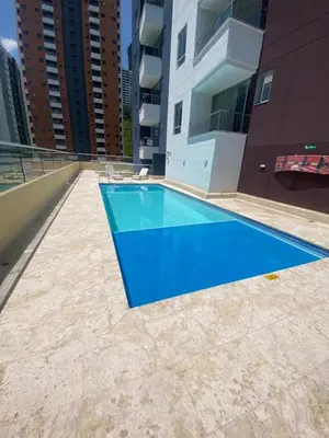 a swimming pool on the roof of a building at comodo y acogedor apartamento in Sabaneta