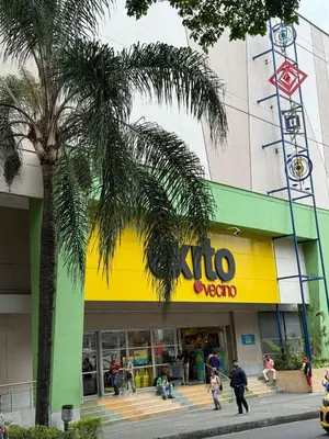 a store with a palm tree in front of it at Casa Bendita - Apto 102 in Medellín