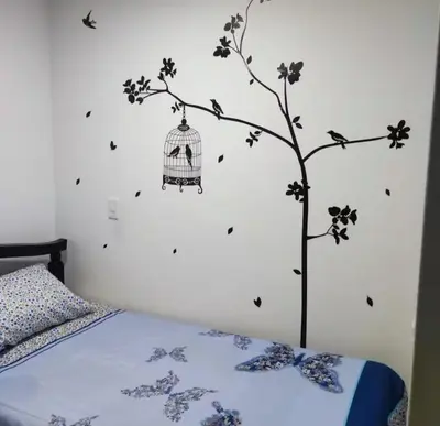 a bedroom with a bird cage on the wall at Habitaciones Privadas, dentro de apartamento, cómodas y muy cercanas al Poblado in Medellín
