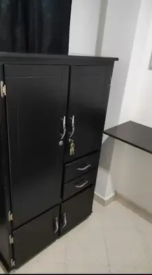 a black cabinet with drawers and a black counter at Habitaciones Privadas, dentro de apartamento, cómodas y muy cercanas al Poblado in Medellín