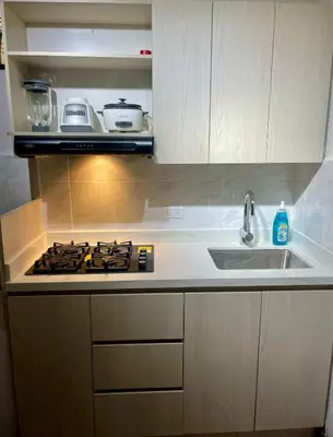 a kitchen with a stove top and a sink at Apartamento laureles estadio N 203 in Medellín