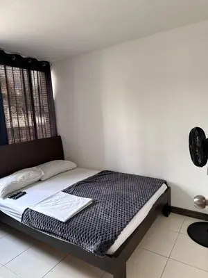 a bedroom with a bed in a room at Apartamento laureles estadio N 203 in Medellín