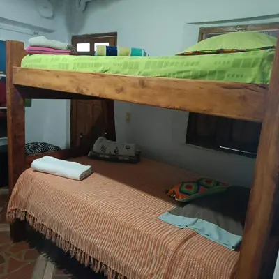 a couple of bunk beds in a room at Cabañas - 5 Continentes Cerca Metrocable ARVI in Guarne