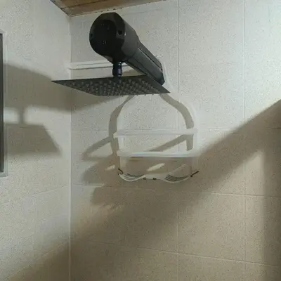 a hair dryer is on a shelf in a bathroom at Cabañas - 5 Continentes Cerca Metrocable ARVI in Guarne