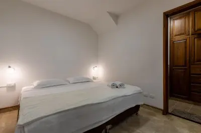 a bedroom with a bed with two towels on it at Stay in the most welcoming place in Medellín