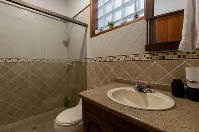 a bathroom with a sink and a toilet at Stay in the most welcoming place in Medellín