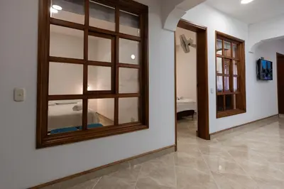 a room with a large mirror on the wall at Stay in the most welcoming place in Medellín