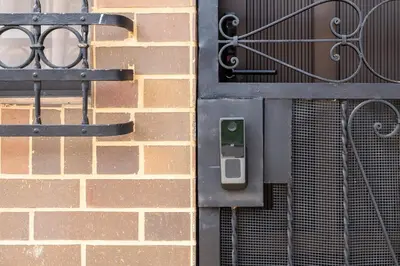a close up of a brick wall with a metal door at Stay in the most welcoming place in Medellín