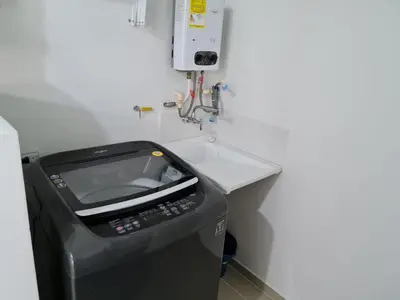 a fax machine sitting next to a sink in a room at Selvatica 1014 in Sabaneta