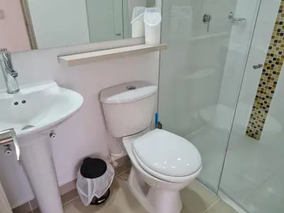 a bathroom with a toilet and a sink and a shower at Selvatica 1014 in Sabaneta