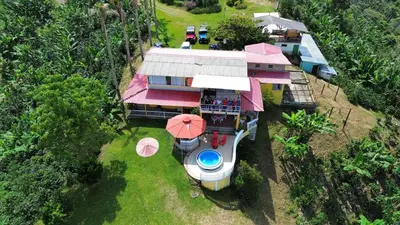 an overhead view of a house with an umbrella at Mirador La Fortuna in San JosÃ©