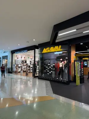 aihad store in a shopping mall with people walking in it at Casa Bendita - Aparta estudio 104 in Medellín