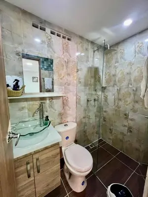 a bathroom with a toilet and a sink and a shower at Magnificent apartment near Lleras and Provenza in Medellín