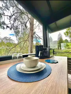 a table with a bowl on top of a table at Cabaña Del Lago - Cerca Metrocable ARVI in Guarne