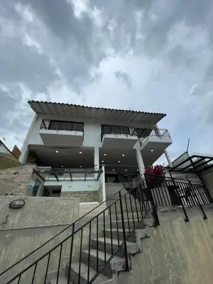 a building with a staircase in front of it at Casa Hotel Spa Carolina in Carolina del Principe