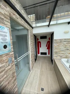 a building with a door with a sign on it at Casa Hotel Spa Carolina in Carolina del Principe