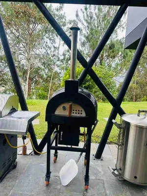 a small stove and a drum on a patio at Country house near the airport and Medellin in El Retiro