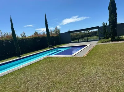 a swimming pool in the middle of a yard at Country house near the airport and Medellin in El Retiro