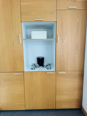 a wooden cabinet with a stove in it at Villa near the airport and Medellin in El Retiro