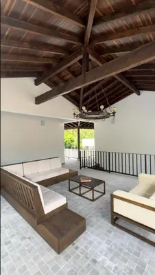 a living room with couches and tables and a wooden ceiling at Casa La Oronda - Hotel Boutique- Cauca Viejo in Jericó