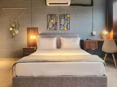 a bedroom with a large bed in a room at The Hub by Wynwood House in Medellín
