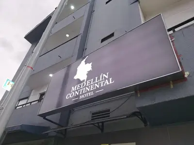 a sign on the side of a building at Medellin Continental Hotel in Medellín