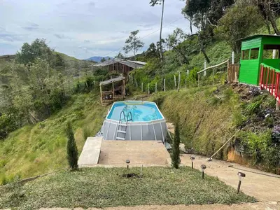 a small swimming pool on a hill with a train at 180 degree Mountain View with good size pool in Piedra El Marcial